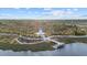 Aerial view of community lake with observation tower and walking paths at 20450 Passagio Dr, Venice, FL 34293