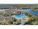 Luxury community pool and clubhouse with surrounding landscape at 20450 Passagio Dr, Venice, FL 34293
