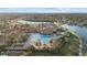 Community pool, tennis courts, and clubhouse in a luxury community setting at 20450 Passagio Dr, Venice, FL 34293