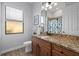 Guest bathroom with granite countertop and shower/tub combo at 20450 Passagio Dr, Venice, FL 34293