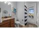 Bathroom with access to a private patio at 20450 Passagio Dr, Venice, FL 34293