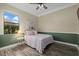 Bright bedroom with wood flooring and ceiling fan at 20450 Passagio Dr, Venice, FL 34293