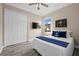 Spacious bedroom with wood flooring and ceiling fan at 20450 Passagio Dr, Venice, FL 34293