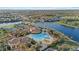 Aerial view of community pool, tennis courts, and clubhouse at 20450 Passagio Dr, Venice, FL 34293