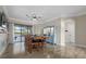 Formal dining room featuring a large wooden table and access to the backyard at 20450 Passagio Dr, Venice, FL 34293