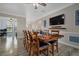 Open concept dining room with a view into the kitchen and living areas at 20450 Passagio Dr, Venice, FL 34293