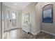 Bright and airy entryway with a stylish console table and elegant rug at 20450 Passagio Dr, Venice, FL 34293