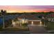Single-story home with tile roof and two-car garage at 20450 Passagio Dr, Venice, FL 34293