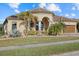 One-story home with a three car garage and landscaped yard at 20450 Passagio Dr, Venice, FL 34293