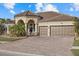 Beautiful home with three car garage and paver driveway at 20450 Passagio Dr, Venice, FL 34293