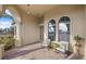 Inviting front porch with rocking chairs, offering a relaxing spot to enjoy the view at 20450 Passagio Dr, Venice, FL 34293