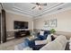 Relaxing Gathering room with a fireplace and built-in entertainment center at 20450 Passagio Dr, Venice, FL 34293