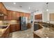 Spacious kitchen with large island, granite countertops, and stainless steel appliances at 20450 Passagio Dr, Venice, FL 34293