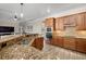 Modern kitchen with granite countertops, ample cabinetry, and stainless steel appliances at 20450 Passagio Dr, Venice, FL 34293