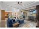 Open living room with a view of the kitchen and outdoor space at 20450 Passagio Dr, Venice, FL 34293