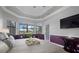 Spacious main bedroom with a large TV and water views at 20450 Passagio Dr, Venice, FL 34293