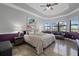 Large main bedroom with water views and plenty of natural light at 20450 Passagio Dr, Venice, FL 34293