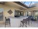 Covered patio features a built-in bar with seating for four at 20450 Passagio Dr, Venice, FL 34293