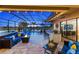 Enclosed pool and patio area with bar and comfortable seating at 20450 Passagio Dr, Venice, FL 34293