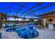 Beautiful pool and patio with lake view and screened enclosure at 20450 Passagio Dr, Venice, FL 34293
