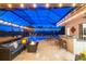 Enclosed pool area with patio furniture, fire pit, and summer kitchen at 20450 Passagio Dr, Venice, FL 34293