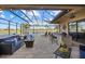 Relaxing pool area with covered patio, spa, and outdoor kitchen at 20450 Passagio Dr, Venice, FL 34293