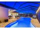 Stunning pool with lighting, and multiple seating areas at 20450 Passagio Dr, Venice, FL 34293