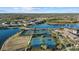 Tennis and pickleball courts located near a lake and community clubhouse at 20450 Passagio Dr, Venice, FL 34293