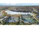 Community tennis courts near a lake and residential neighborhood at 20450 Passagio Dr, Venice, FL 34293