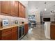 Wet bar with wine cooler and custom cabinetry at 20450 Passagio Dr, Venice, FL 34293