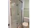 Shower with sliding glass doors and tiled walls at 232 Saint Augustine Ave # 704, Venice, FL 34285