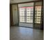 Bedroom with access to a balcony overlooking the city at 232 Saint Augustine Ave # 704, Venice, FL 34285