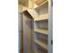 Walk-in closet with shelves and hanging rod at 232 Saint Augustine Ave # 704, Venice, FL 34285
