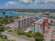Aerial view of condo complex near marina, showcasing the pool at 244 Saint Augustine Ave # 805, Venice, FL 34285