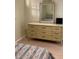 Bedroom with dresser and mirror at 244 Saint Augustine Ave # 805, Venice, FL 34285