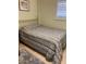 Cozy bedroom with full-size bed and striped comforter at 244 Saint Augustine Ave # 805, Venice, FL 34285