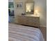 Bedroom with dresser and mirror, offering ample storage at 244 Saint Augustine Ave # 805, Venice, FL 34285