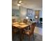 Bright dining area with wood table and chairs, offering a view into the living room at 244 Saint Augustine Ave # 805, Venice, FL 34285