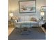 Living room featuring a sofa, coffee table, and coastal artwork at 244 Saint Augustine Ave # 805, Venice, FL 34285