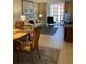 Spacious living room featuring light flooring, comfortable seating, and large artwork at 244 Saint Augustine Ave # 805, Venice, FL 34285