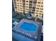 Community pool with plenty of lounge chairs at 244 Saint Augustine Ave # 805, Venice, FL 34285