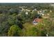 Aerial view showing home, pool, and surrounding landscape at 2542 Northway Dr, Venice, FL 34292