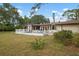 Home features a large backyard with deck at 2542 Northway Dr, Venice, FL 34292