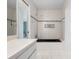 Bathroom featuring a bathtub, shower, and tiled walls at 2542 Northway Dr, Venice, FL 34292