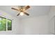 Empty bedroom with ceiling fan, window, and white walls at 2542 Northway Dr, Venice, FL 34292