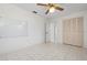 Bedroom with ceiling fan, closet, and tiled floor at 2542 Northway Dr, Venice, FL 34292