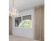 Dining area with light blue walls, chandelier, and neutral carpet at 2542 Northway Dr, Venice, FL 34292