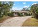 Single-story home with driveway and landscaping at 2542 Northway Dr, Venice, FL 34292