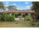 Single-story home with landscaped yard and arched entryway at 2542 Northway Dr, Venice, FL 34292