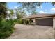 Brown double garage door and a paved driveway at 2542 Northway Dr, Venice, FL 34292